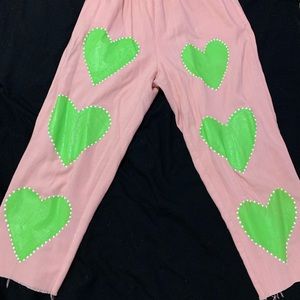 One of a kind, pink cropped stretchy pants with hand painted hearts.